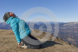 Woman trekker relaxing in mountains