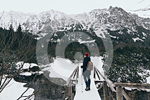 Woman trekking in High Tatra mountains in winter, Slovakia