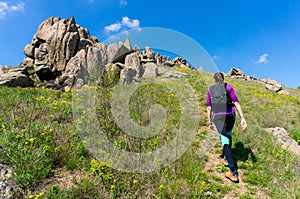 Woman trekking in Macin Mountains in Romania