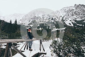 Woman trekking in High Tatra mountains in winter, Slovakia