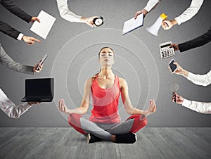 Woman tries to keep calm with yoga due to stress and overwork at wok photo