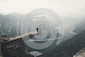 Woman On Trolltunga, The Famous place in Norway, View On Trolltunga And Mountain Landscape, Odda, Norway