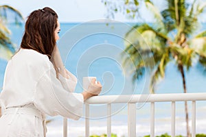 Woman on a tropical balcony