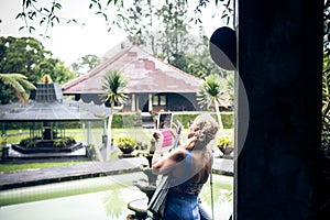 Woman on the tropical balinese landscape background, North of Bali island, Indonesia.