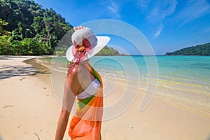 Woman on tropical beach photo
