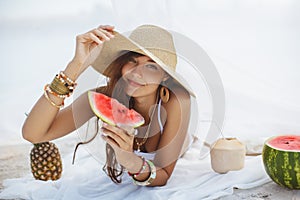 Woman on the Tropical Beach Eating Watermelon