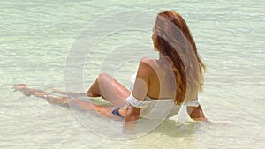 Woman on tropical beach Maldives island.