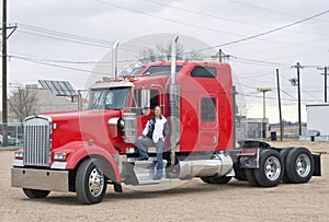 Woman truck driver on the step