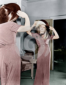 Woman trying on hat