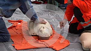 Woman trying resuscitation technique on dummy. First aid reanimation, CRP training, medicine, healthcare and medical