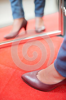 woman trying on stilletos