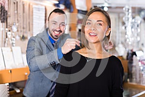 Woman trying stylish chainlet with pendants