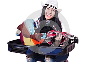 Woman trying to pack too much isolated