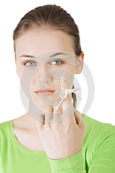 Woman trying to remember with the piece of string round her finger