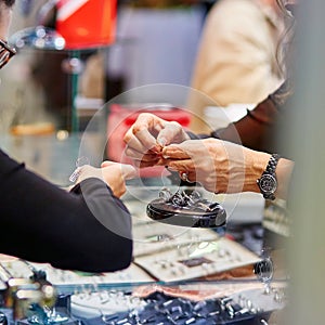 Woman trying wedding rings