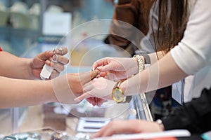 Woman trying wedding rings at a jeweler