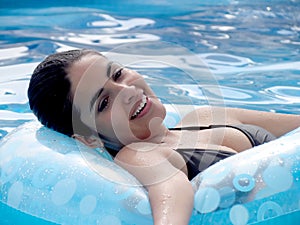 Woman with tube in pool