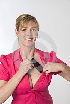 Woman tucking mobile phone into her bra