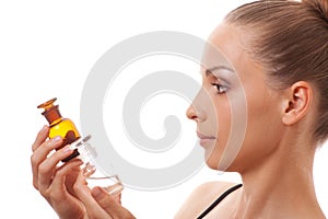 Woman with two bottles of medicine or perfume