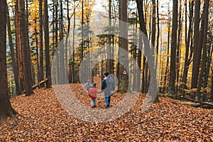 Woman with two children in forest