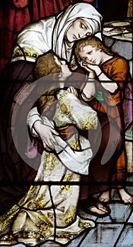 Woman with two children in stained glass