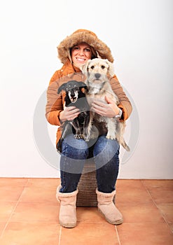 Woman with two dogs on lap