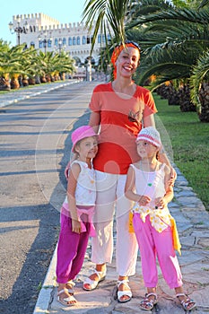 Woman with two girls is in way