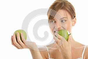 Woman with two green apples
