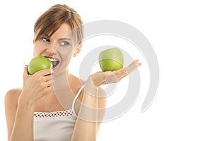 Woman with two green apples