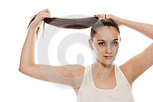 Woman tying her hair