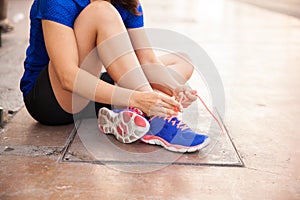 Woman tying her shoelaces