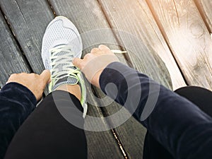 Woman tying laces Sport Running Workout Training Outdoor