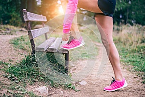 Woman tying running shoes