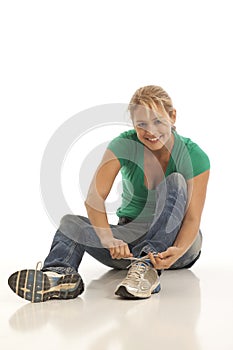 Woman tying shoe