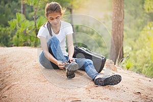 Woman tying shoe laces, Closeup of female tourist getting ready