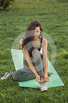 Woman tying shoes. Healthy lifestyle concept. Happy Sport Life.