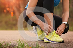 Woman tying sport shoes