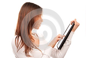 Woman typing on electronic tablet touch pad