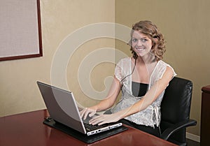 Woman typing on a laptop