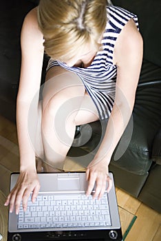 Woman typing on laptop