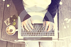 Woman typing on a laptop