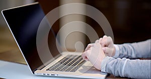 Woman typing on a laptop computer