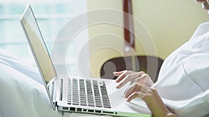 Woman typing laptop computer online meeting at home office work