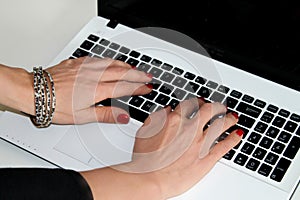 Woman typing on the laptop.