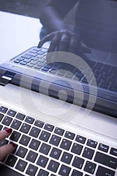Woman typing on laptop pc