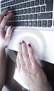 Woman typing on laptop pc