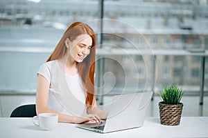 Woman typing on laptop at workplace Woman working in home office hand keyboard