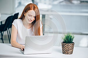 Woman typing on laptop at workplace Woman working in home office hand keyboard