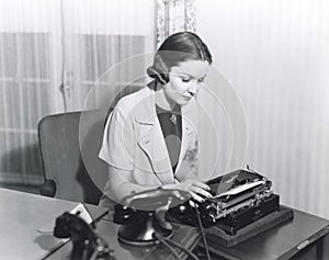 Woman typing a letter