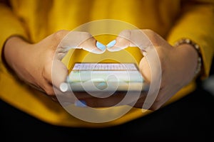 Woman Typing Phone Message On Social Network At Night